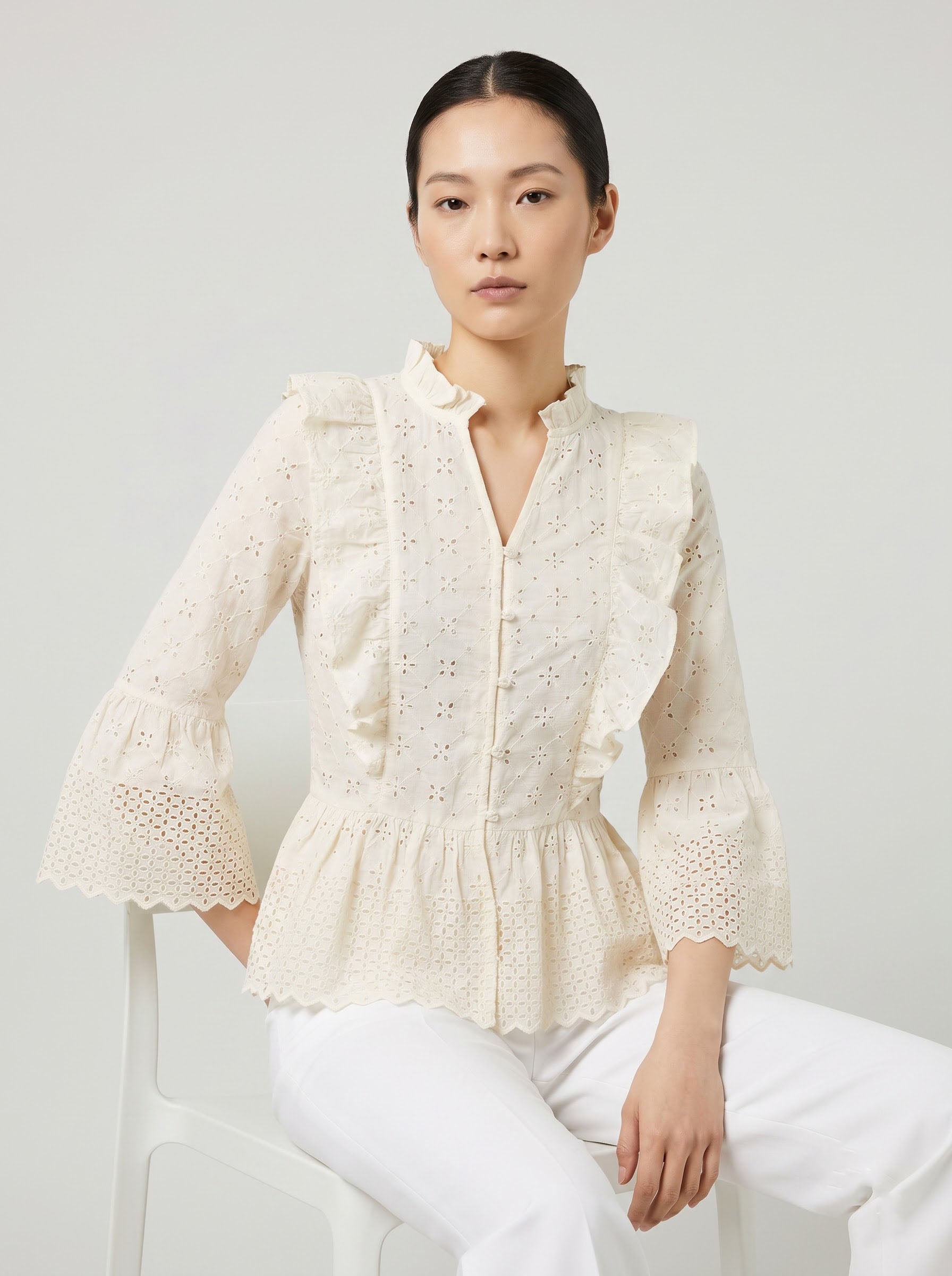 Women Cream Schiffli Embroidered Peplum Top with Ruffle Detail